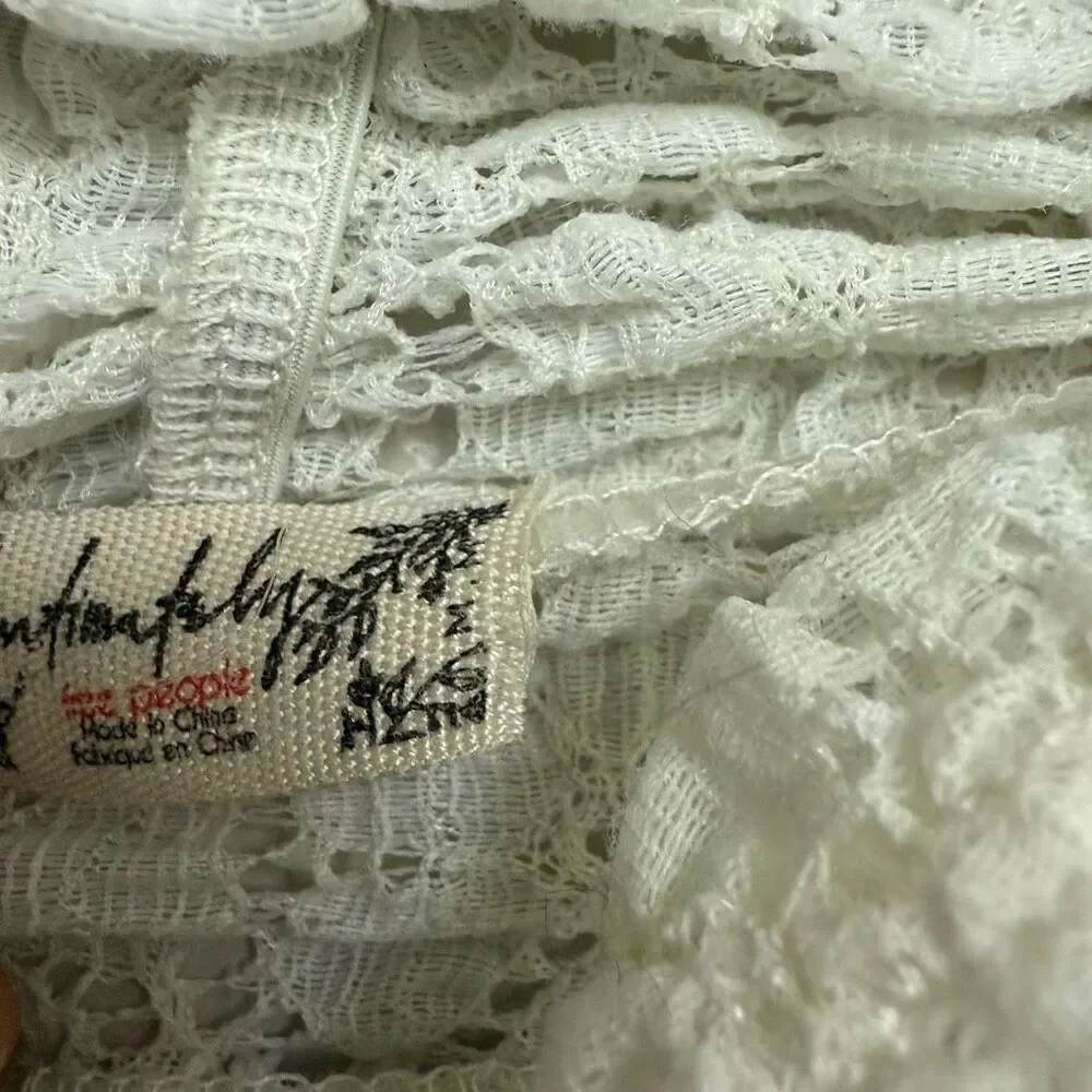 Free people white crotchet style long sleeve bodysuit size medium